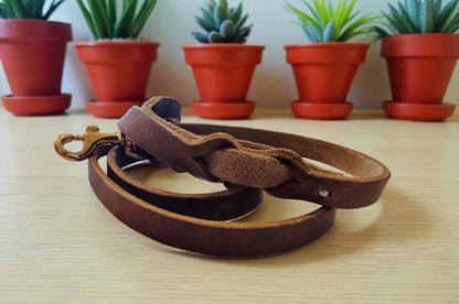 Gray leather leash with black fittings
